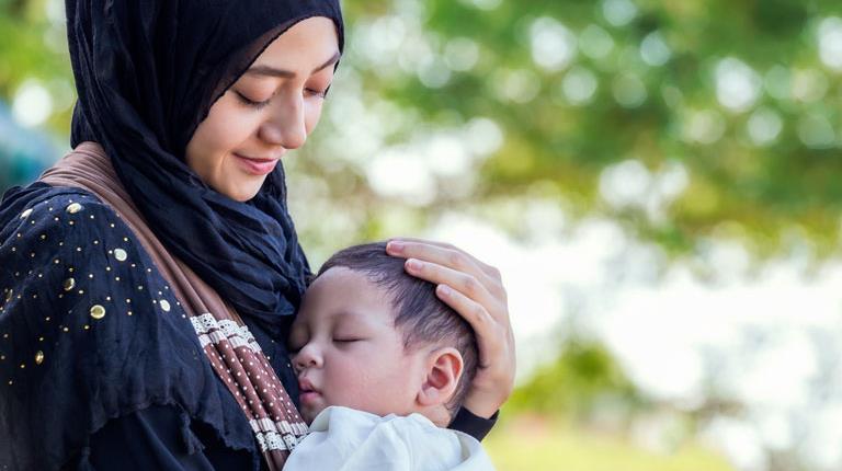 Muslim woman with child