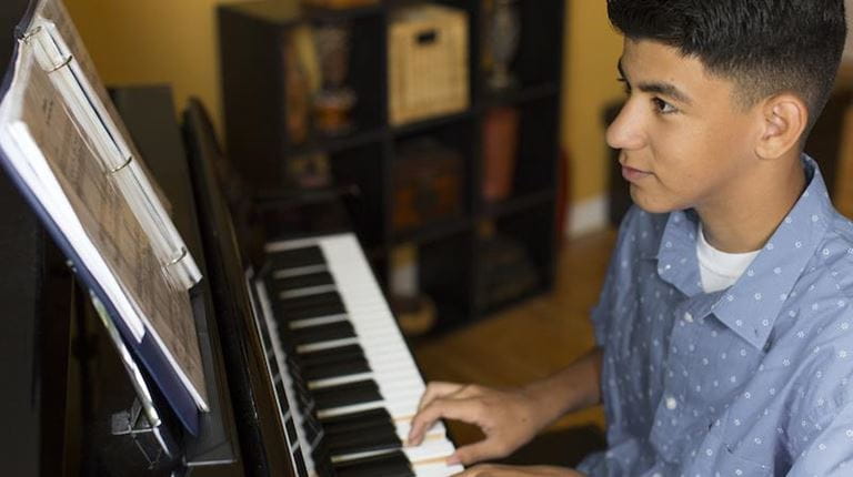 boy playing piano
