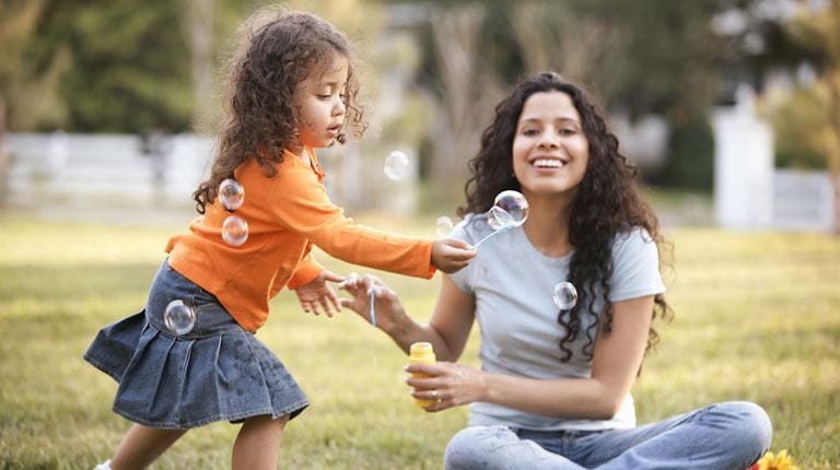 Female adult and child at a park
